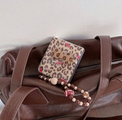 Samsung Galaxy Z Flip 7 Leopard Print Bow Foldable Phone Case with Wrist Strap